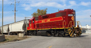 Norfolk & Portsmouth Belt Line Railroad #5260 crossing Elm Ave. Portsmouth, Virginia. At U.S. Norfolk Naval Shipyard.5260 is painted a commemorative scheme as part of the Norfolk Southern, Heritage Program. (David E. George III/Wikimedia Commons)