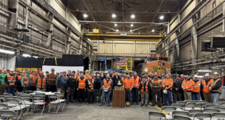 Members at BNSF’s Minneapolis Northtown shop celebrate their Safety Bell achievement. (Caption and Photograph Courtesy of BNSF)