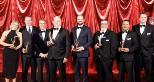 CPKC’s Fuel Center of Excellence team (shown here with President and CEO Keith Creel, third from left) earned the railroad’s 2025 CEO Award for Excellence in the Cost Control category. (Screen Grab from CPKC video.)