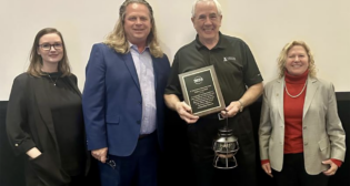 OLI Board Chair and ASLRRA SVP, Safety, Regulatory, and Environmental Policy Jo Strang (far right) pictured with F. Tom Roberts Memorial Volunteer Award honoree Bob Crawford (center). They are joined by Jessica Devorsky, Texas Operation Lifesaver State Coordinator and F. Tom Roberts Award Committee Chair (far left), and Mark Sexton, Oklahoma Operation Lifesaver State Coordinator. (OLI Photograph)