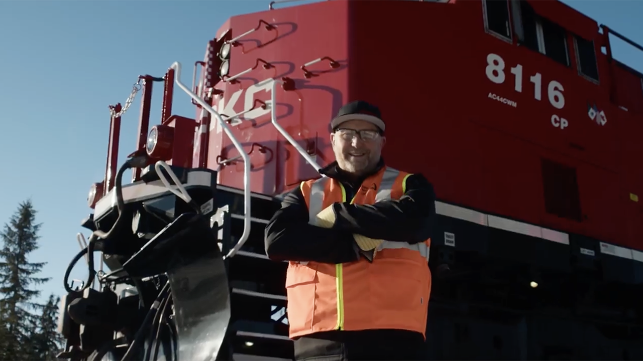 Darryl Perry, a CPKC locomotive engineer in Sparwood, B.C., Canada, is one of the 200-plus “CPKC Hypermilers” who the railroad said “use their ‘feel’ for a locomotive and in-depth local knowledge, coupled with fuel-efficient strategies, to operate trains safely while reducing excess fuel burn.” (Screen Grab from CPKC Video)