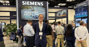 Alvaro Senador-Gomez (center) is Siemens Mobility’s new President of Rail Infrastructure in North America. He joins his team at Railway Interchange in Indianapolis to showcase the company’s latest technology. (Photograph by Marybeth Luczak)