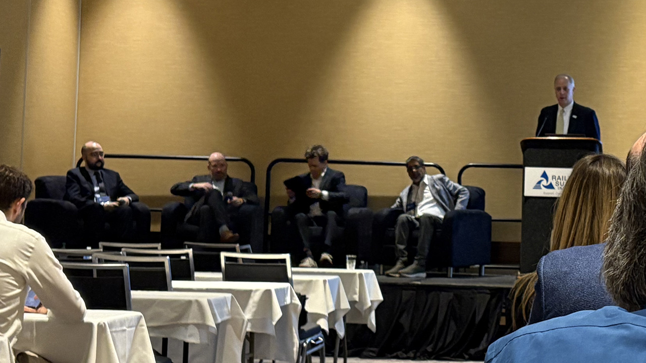 RSI President Jim Riley (far right) moderated a fireside-chat style session with (left to right) Benji Schwartz, Director of Government Affairs and Advocacy, APTA; Greg Regan, President, Transportation Trades Department, AFL-CIO; Robert Pearsall, Partnerships Director, USHSR; and Husein Cumber, Senior Advisor, Brightline Holdings. (Marybeth Luczak Photograph)