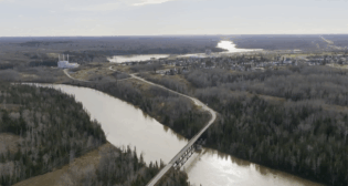 Abitibi Trestle Bridge in the foreground of Abitibi Connex in Iroquois Falls, Ontario, Canada (formerly Abitibi Paper Mill). (CNW Group/BMI Group)