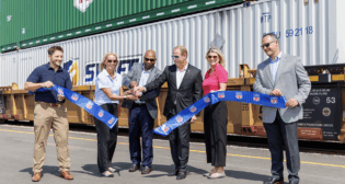 UP officially cut the ribbon for its new Kansas City Intermodal Terminal. From left, UP’s Ryan Steinbach, Assistant Vice President-Premium; Kari Kirchhoefer, Senior Vice President-Marketing and Sales; Kenny Rocker, Executive Vice President-Marketing and Sales; Hunsdon Cary, Vice President-Premium; Laura Heisterkamp, Assistant Vice President-Premium; and Zach Russell, General Manager-Premium. (UP Photograph)