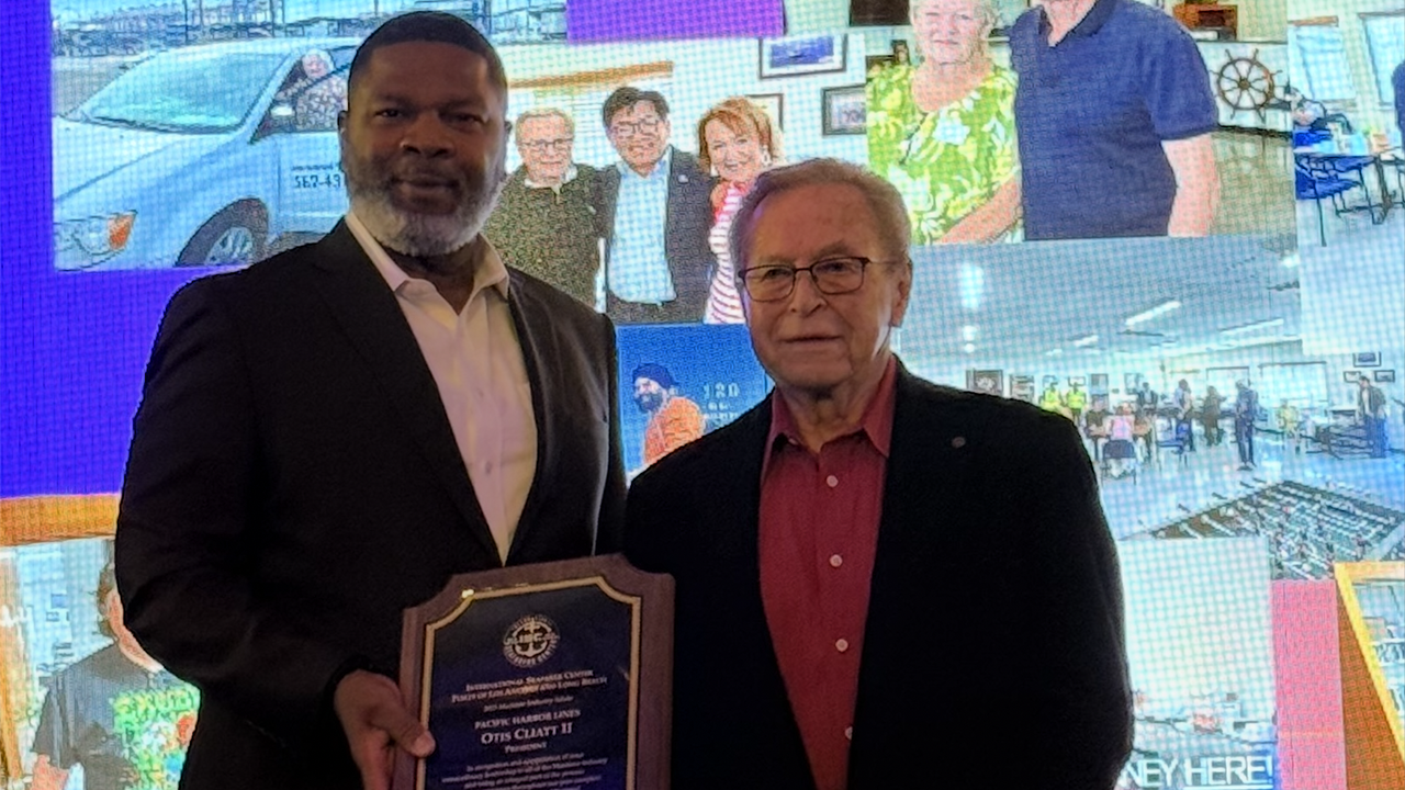 Pacific Harbor Line and President Otis L. Cliatt II (left) received the 2025 Maritime Industry Salute Award on Oct. 2. It was presented by Guy Fox, Chairman of the Board of the International Seafarers Center of the Ports of Long Beach and Los Angeles (right). (Photograph Courtesy of PHL)