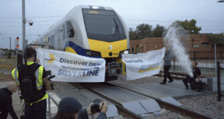 “Built in our Salt Lake City facility, these trains are designed for comfort, accessibility, and sustainability,” Stadler, the manufacturer of the Silver Line’s eight DMUs reported via LinkedIn. “With seating for 230 passengers, standing room for 100, and compliance with EPA Tier 4 emissions standards, they’re ready to serve the region with quiet, efficient, and modern mobility. 🛤️ The Silver Line spans 26 miles, connecting seven cities and DFW Airport. To everyone who helped bring this vision to life: thank you. We’re honored to be part of this journey.” (Photograph Courtesy of Stadler)