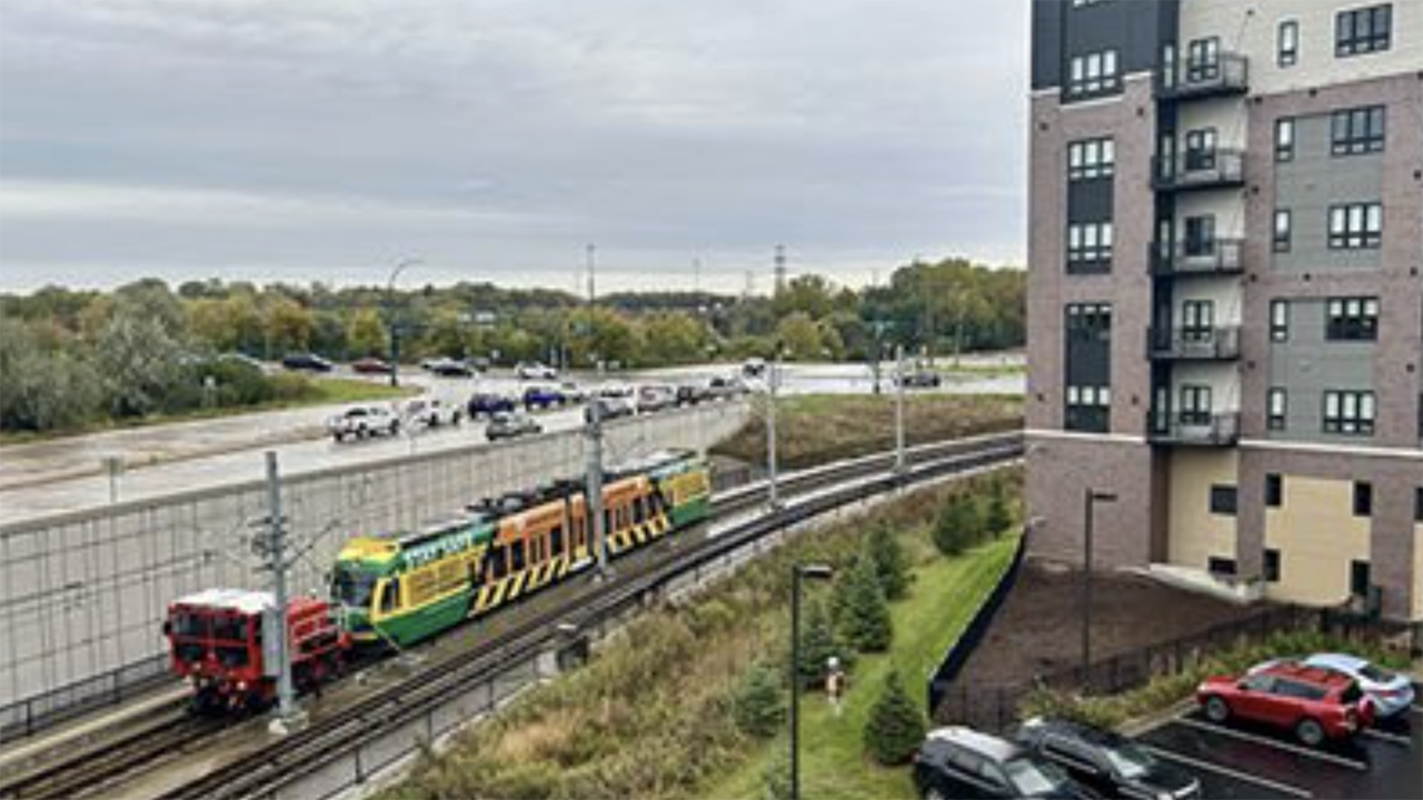 The first light rail train is pulled along the Green Line Extension near the Southwest Station in Eden Prairie, Minn., to test the tracks the entire length of the line. (Caption and Photograph Courtesy of Metro Transit)