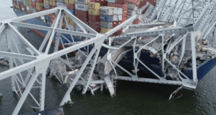 The containership Dali with portions of the collapsed Francis Scott Key Bridge across its forward deck on March 28, 2024. (Courtesy of NTSB)
