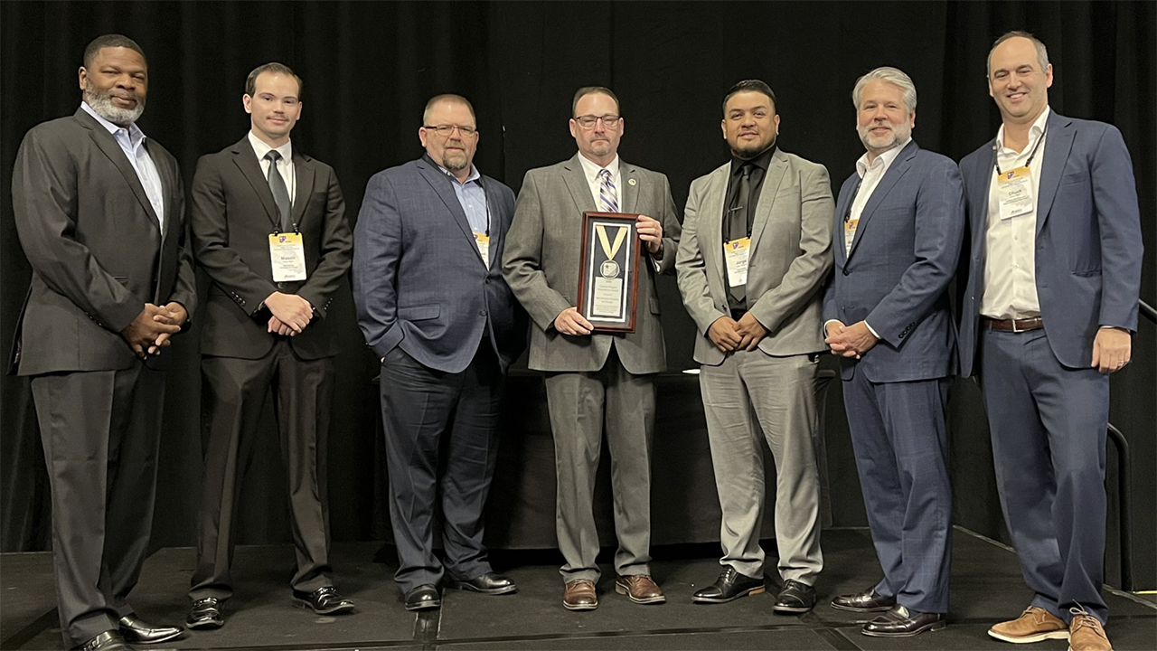 At ASLRRA’s recent Central and Pacific Region Meeting, which included more than 300 attendees, ASLRRA Executive Board Members Otis L. Cliatt II (pictured, left; VP, Pacific Region) and Matthew O. Walsh (second from right; Chair) and ASLRRA President Chuck Baker (right) presented the Belt Railway Company of Chicago with the President’s Award in the “More than 500,000 Person-Hours Worked” category. Accepting the safety award were Junior Software Developer Mason Myre, Assistant Chief Mechanical Officer Robert Perham, Superintendent Jason Charbonneau and Manager of Signals Jorge Guerrero (second through fifth from left, respectively). (Photograph Courtesy of ASLRRA)