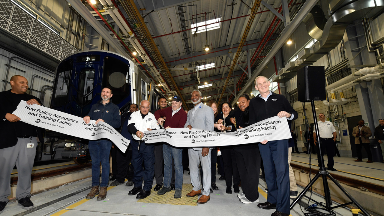 MTA Chair and CEO Janno Lieber, MTA New York City Transit President Demetrius Crichlow, MTA Construction & Development President Jamie Torres-Springer, and other officials cut the ribbon on the new Railcar Acceptance and Testing Facility in Sunset Park on Nov. 21. (Marc A. Hermann / MTA)