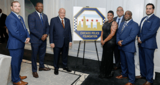 During the True Blue gala on Nov. 14, Herbert Smith (left), NS Regional Vice President of Government Relations, awarded a grant to the Chicago Police Foundation. Standing next to Smith are CPD Superintendent Larry Snelling and Chicago Police Foundation Chairman Rick Simon. (Caption and Photograph Courtesy of NS)